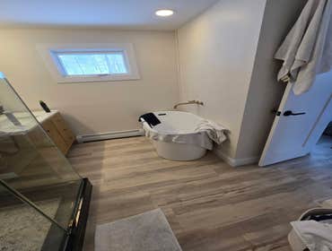 Photos by Kennison Construction LLC #2 Remodeled 1st floor. Demo old bathroom and remodeled it to a master bathroom with a separate powder room