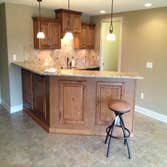 Large Basement A great basement finish we completed with built in bar and hidden pantry along with two bedrooms and fireplace.