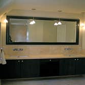 Zen Master Bath Design The remodel of this master bathroom was defined by the client’s request for a rain shower unencumbered by walls. To accomplish 