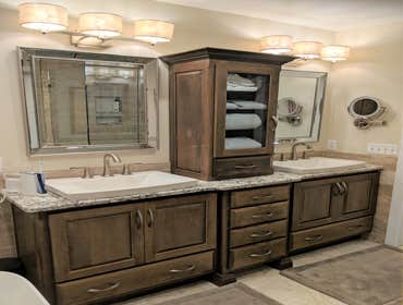 Master Bathroom with Free Standing Tub and Tiled Shower by Mione Family Remodeling