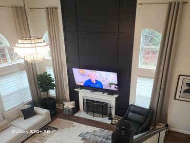 Photos by Construction Bros LLC #1 Accent wall installed to living room wall, boasting 18 foot ceilings. Modern, sleek, and a stunning focal point.