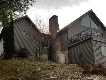 Siding and copper chimney flashing