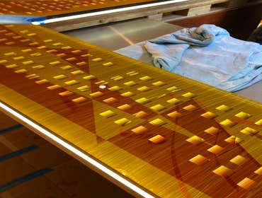 Illuminated glass counter top private residence 18' laminated art glass counter top set on 6mm LED light panel for guest kitchen in private residence.