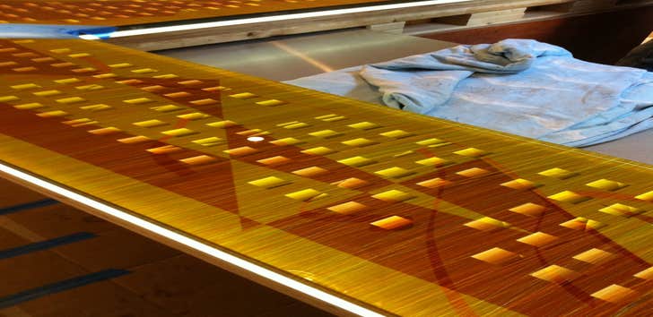 Illuminated glass counter top private residence 18' laminated art glass counter top set on 6mm LED light panel for guest kitchen in private residence.