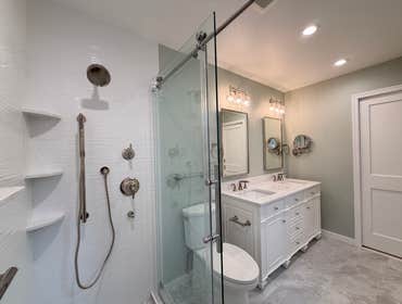 Catherine's Bathroom Reno! A calm, spa-inspired bathroom designed for everyday luxury ✨
Clean white tile, a sleek glass shower, soft sage walls, and a 