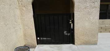 Wrought Iron Install a wrought iron gate and security bar in enclosed patio
