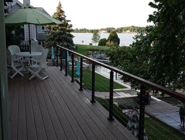 Photos by Qac Construction #6 Remove decking and install composite decking with cable railing system. Cover sidewall areas with stained cedar wood.