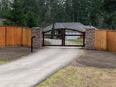 Automatic Driveway Gate Installation of automatic gate. This included a higher end gate, photo beam sensors between gate, key pad, wireless opperation,