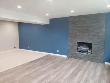 Luxury vinyl plank flooring, stack stone fireplace , lighting,