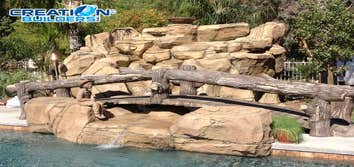Custom Water Feature with bridge New water Feature by the pool