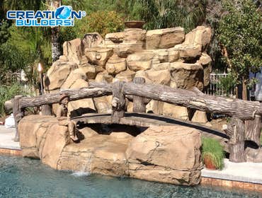 Custom Water Feature with bridge New water Feature by the pool