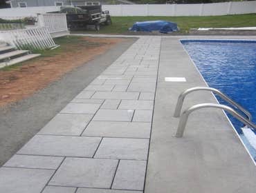 Photos by Dunn Landscape Construction #1 After initial pool installation provide all hardscape including retaining walls, pool deck, walkways and plant
