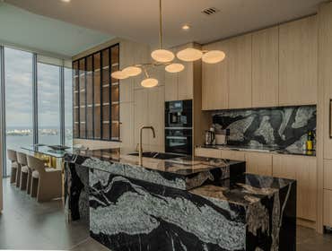 Biscayne Beach Miami Luxury Condo Renovation This full-home renovation focused on creating a sophisticated, modern residence with an emphasis on dark t
