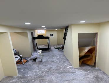 Photos by Your Expendable Services LLC #1 Basement remodeling project completed with new framework, walls placed and painted. New recess lights and LPV