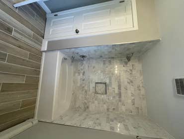 Guest Bath Reno Before and After Full gut of bathroom, raised soffits, new window