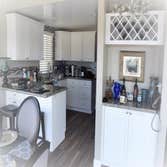 Beach Style Kitchen & Bathroom Remodel with Bay View Window Installation