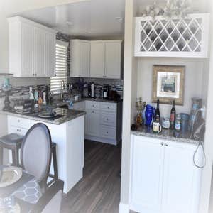 Beach Style Kitchen & Bathroom Remodel with Bay View Window Installation