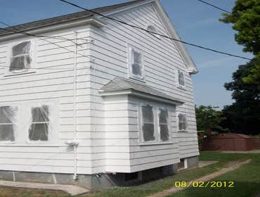 Brilliant Painting, LLC Exterior Project 1 Before and after photos of a full house that has been power washed, scraped, hand sanded, primed, and painte