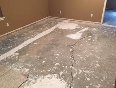 Basement leveling Westminster, CO Basement floor with 2-4 inches of drop, infilled and self-leveled out to perfectly level.