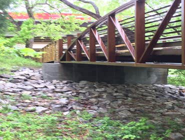 Photo(s) from RamJack Mississippi LLC Boardwalk helical piles with battered piles. Bridge abutment piles