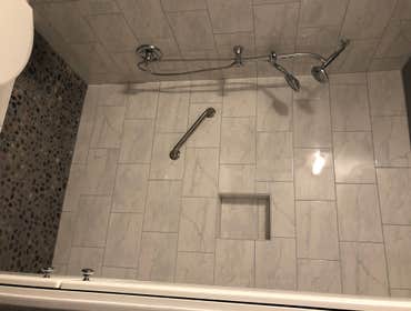 Bathroom Remodel Simple bathroom remodel. Custom shower with therapeutic pebble stone shower pan, new vanity, mirror, light, toilet, paint, and a beaut