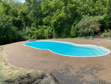 Photos by Guevara Alexander #1 A curated collection of our high-end residential concrete work, including stamped patios, exposed aggregate driveways, w