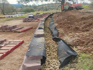 Photos by Dcb Design Create Build #5 Retaining wall installation project in Coulterville, CA to stabilize slope and create usable, level ground around 