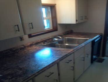 Kitchen Upgrade Painted cabinets and installed new counter tops, sink and flooring