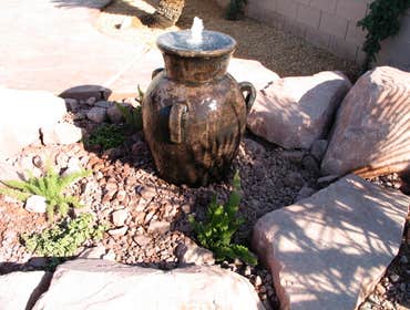 Tech-Noir Landscapes, Inc. Photos This display shows an array of fire pits, water features, and barbeques that add that special touch. Hard scape photo