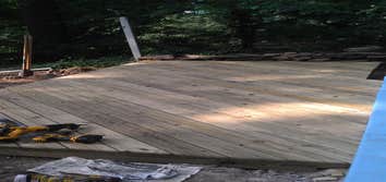 Pool Deck and stone wall A tree fell across this customers stone retaining wall and destroyed it. We rebuilt the wall and installed a deck that butted