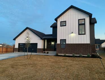 Partial Two Story White and Black Contemporary Farmhouse Woodbridge Farms is an idyllic farmhouse style, gated community in the heart of La Vernia, Tex