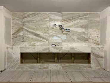 Marble Tile Work by Alzaria Construction LLC This was a tv wall that we tiled