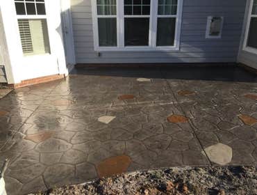 Photos by Stamped Concrete Denver LLC #1 Stamped concrete, often called textured or imprinted concrete, replicates the look of many different stones su