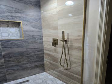 Photos by MC ALISTER TILE #1 5 showers total, was hired after another handyman did not water proof correctly, fixed all water proofing and installed 