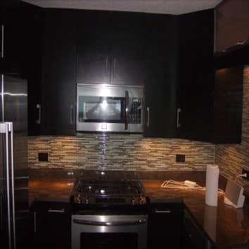 optima views condominiums Remodeling of entire Kitchen And Bathroom new cabinetry, flooring, and stone wall .