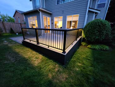 Modern PVC Deck with Integrated LED Stair Lighting This premium low-maintenance deck was built using TimberTech Advanced PVC decking in Coastline with 