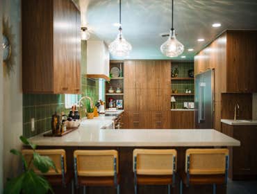 Mid-Century Modern Kitchen Revival A mid-century inspired kitchen remodel that blends warmth and modern function. Custom walnut cabinetry, kale green t