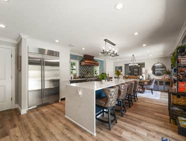 PROFESSIONAL PICTURES OF FULL HOME REMODEL Fully "gutted" this house. Reframed entire interior layout. New standing seam metal roof and 180 square foot