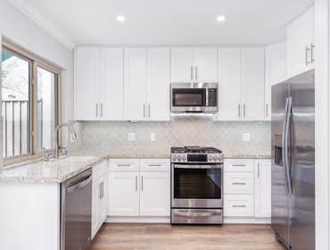 Home Refresh with Luminous White Kitchen in Sacramento, CA 95825 This project transformed the main living areas into a single, bright, and airy open-co