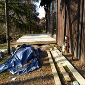Large simple wooden deck Owner wanted a large simple wooden deck for her rustic theme yard.