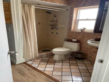 Earth-toned tile work and Vinyl flooring