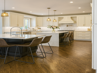 Two-Tone Cream & Black Cabinet Kitchen With Quartz Waterfall Island – Bucks County Renovation