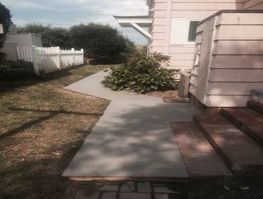Trex Walkway on Oceanfront Home We built a Trex walkway on the side of a customer's home. Original brick was underneath, and the area would get flooded