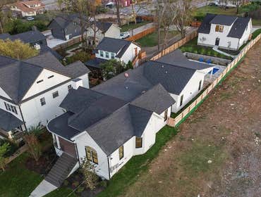 Aerial view showing the home and carriage house in the historic 12 South neighborhood after restoration and addition by CJMC Build.