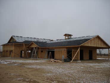 Installing roofing on Barn