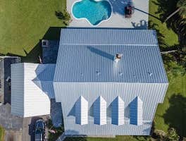 Photos by Modern Roofing Experts Inc #5 5V Crimp (exposed Screws) Mill Finished
