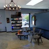 One Glance Salon The business owner wanted a very industrial look to her salon. Bring power to the stylist stations we used EMT power poles and painted