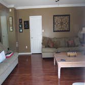 A family's living room and kitchen installed with laminate This project started out with us removing the old existing carpet in the living room and old