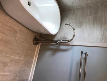 Master Bathroom This master bathroom featured a freestanding tub, heated floors and a five foot shower with multiple head water dispersal. From design