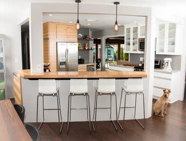 Brobst Kitchen Modern lines with horizontal hickory cabinetry, stainless steel counter tops, copper apron front sink. Blended with traditional white c